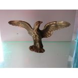 A brass Eagle mascot