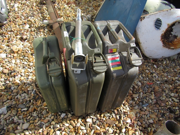 Three jerry cans and a nozzle