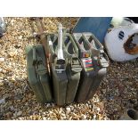 Three jerry cans and a nozzle