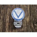 A chromed badge 'The Vintage Sports Car Club'
