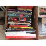 A box of books including various F1 related