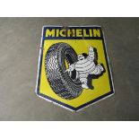 An enamel Michelin sign.
