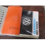 Two folders containing various VW ephemera