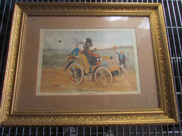 A framed print 'De Zelfbeweger'.