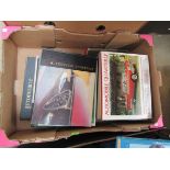 A box of automobile quarterly books