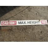An aluminium sign approximately 7' long 'Caution Max Height 10' '