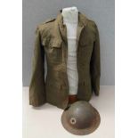 A WWI US soldier's service jacket with US Army insignia and US Army Brodie helmet with division