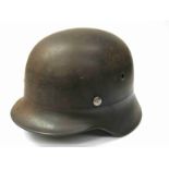 A WWII German steel helmet with lining,