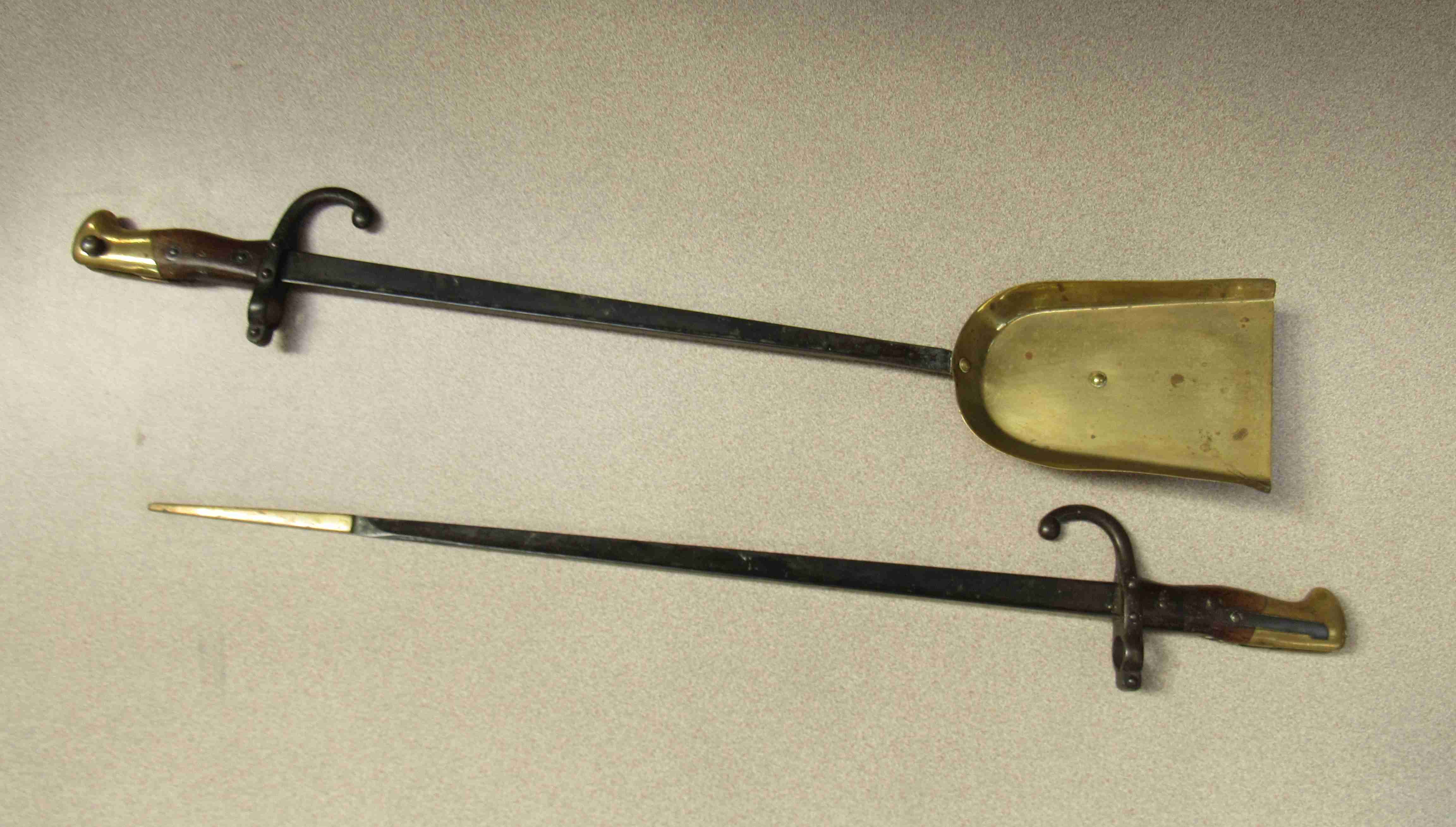 Two late French Gras bayonets converted into fire scoop and poker