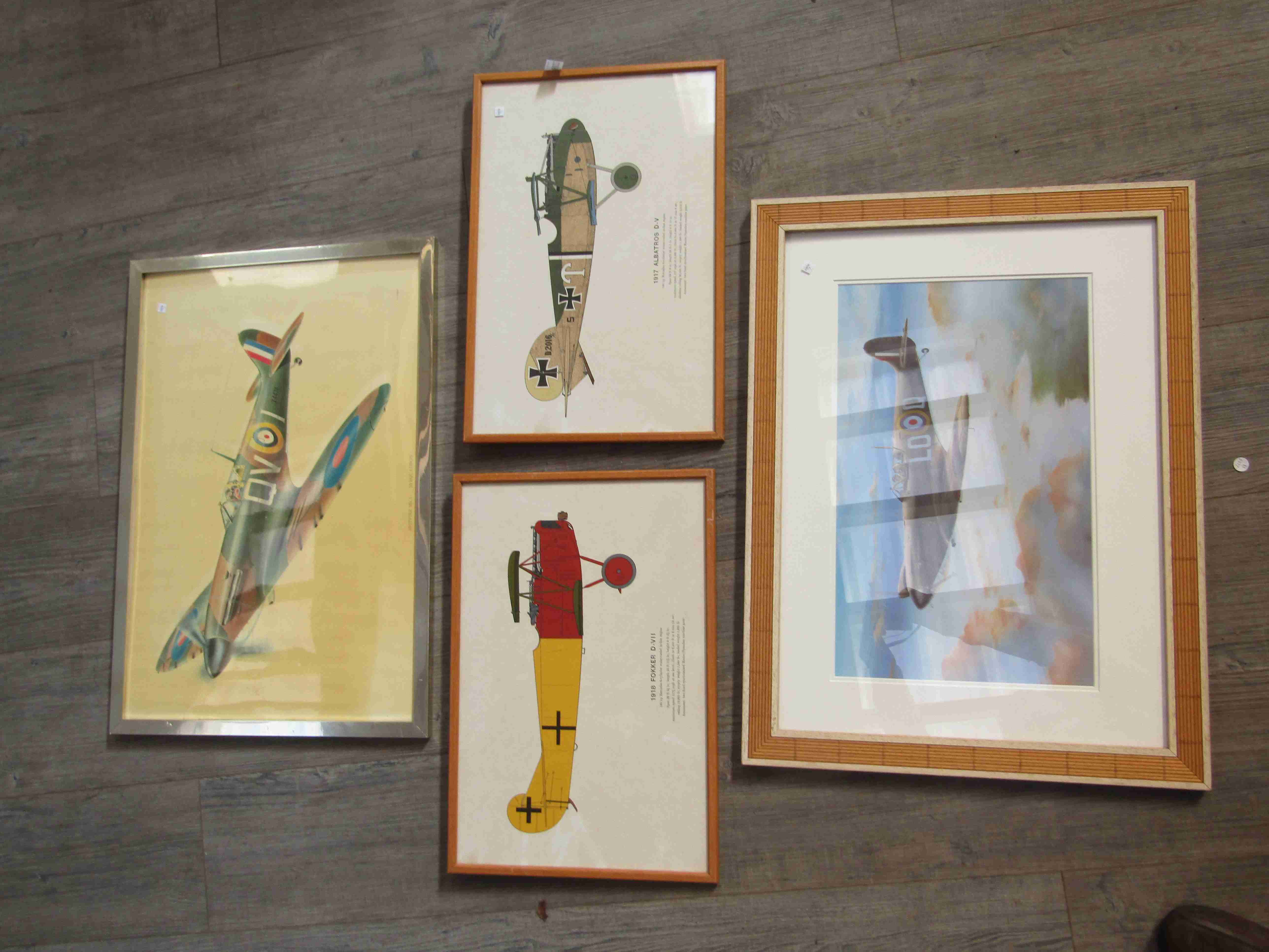 Four aviation prints, including Spitfire and WWI biplanes,