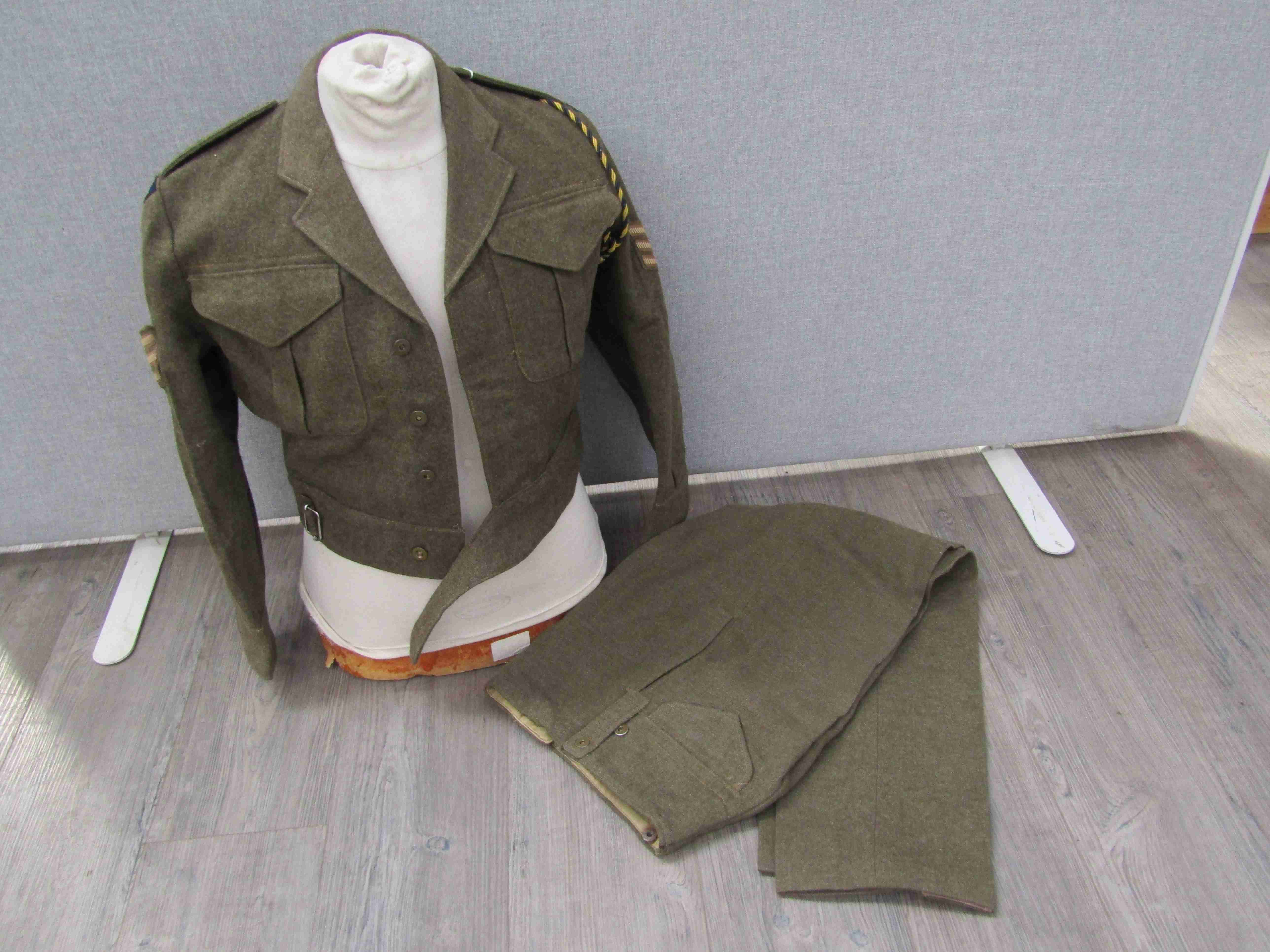 A WWII Canadian-made battledress blouse dated May 1945 together with a matching pair of battledress