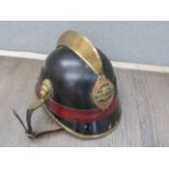 An early-mid 20th Century Austrian Fireman's helmet with Wegscheid A/K Feuerwehr badge,