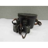 A pair of WWII German Army bush binoculars with Waffen marked black leather case