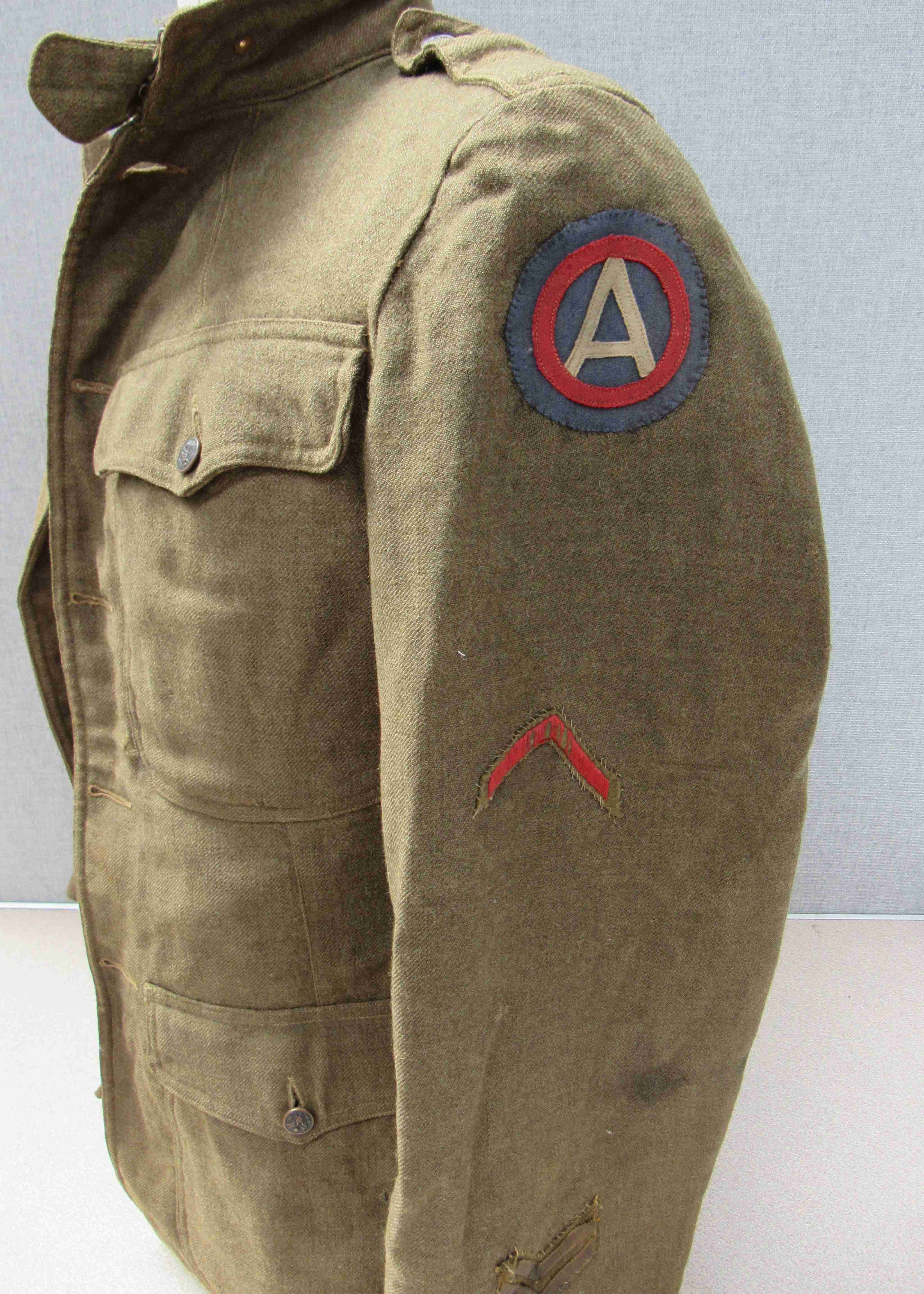 A WWI US soldier's service jacket with US Army insignia and US Army Brodie helmet with division - Image 3 of 8