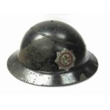 A WWII Worcestershire Fire Service helmet with decal