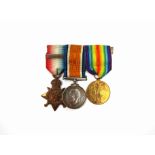 A World War I Mons Star 1914 medal trio with clasp, named to 63733 GNR G.E. Glover RFA / RA
