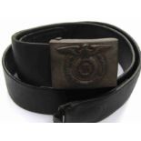 A reproduction German SS belt buckle on original leather belt