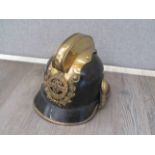 An early-mid 20th Century Austrian Fireman's helmet with "Freiwillige Feuerwehr"