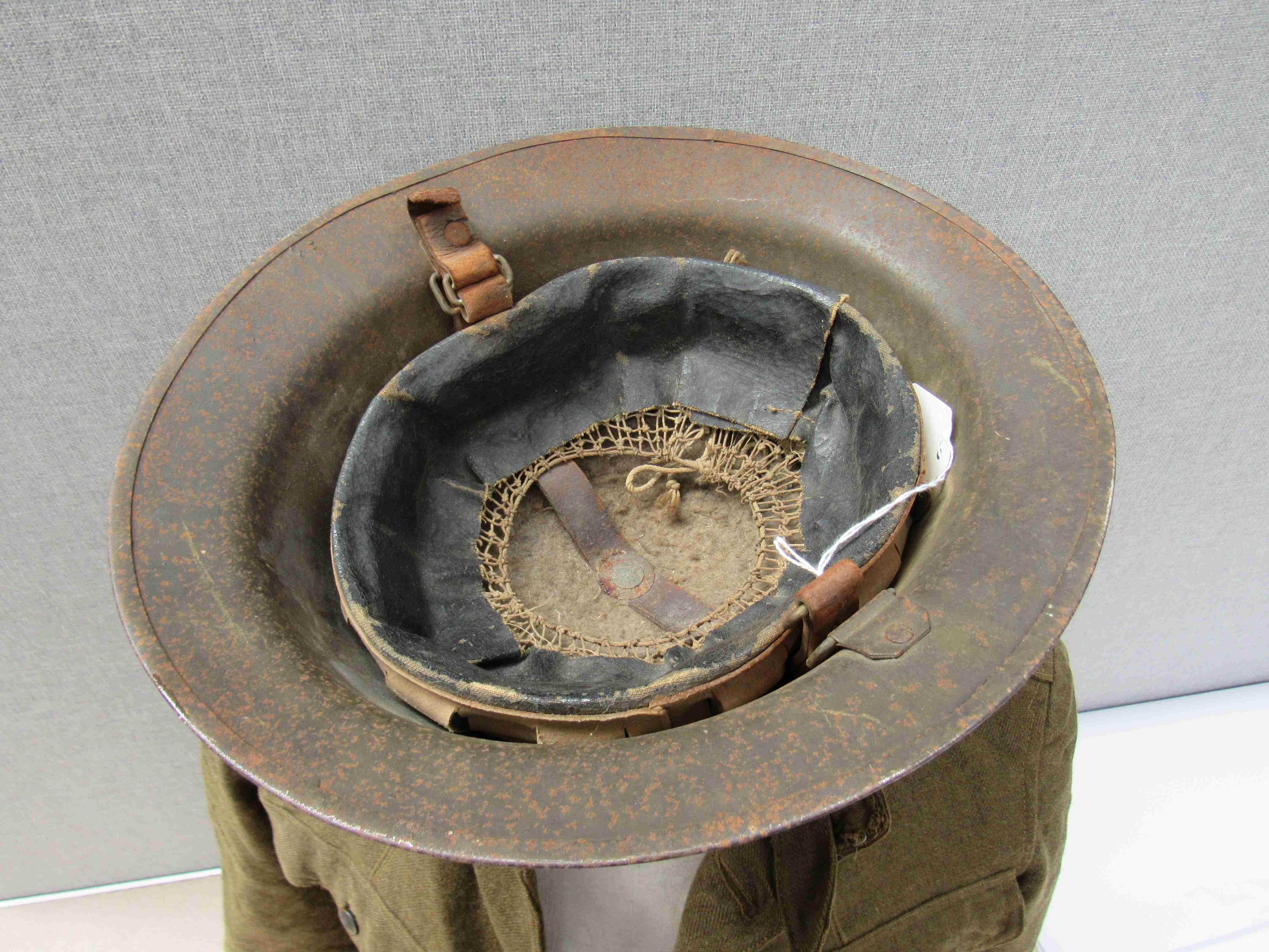 A WWI US soldier's service jacket with US Army insignia and US Army Brodie helmet with division - Image 8 of 8
