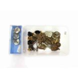 A quantity of military badges and buttons including sweetheart brooches,