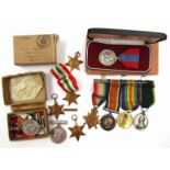 A collection of medals awarded to the Brient family.