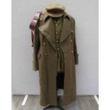 A WWII and later Royal Artillery Officer's uniform consisting of jacket, trousers, peaked hat,