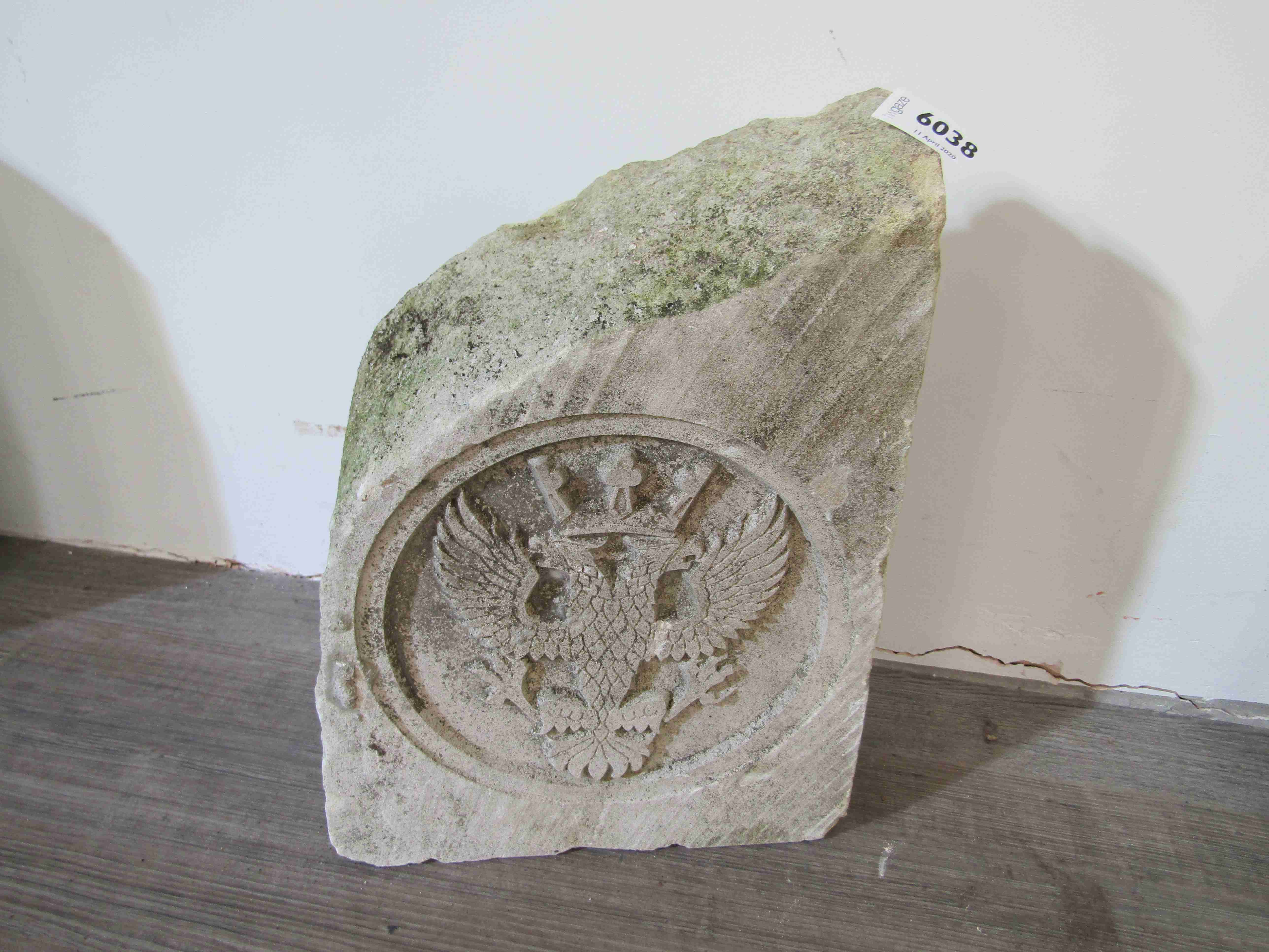 A two headed eagle carved limestone wall insert crest