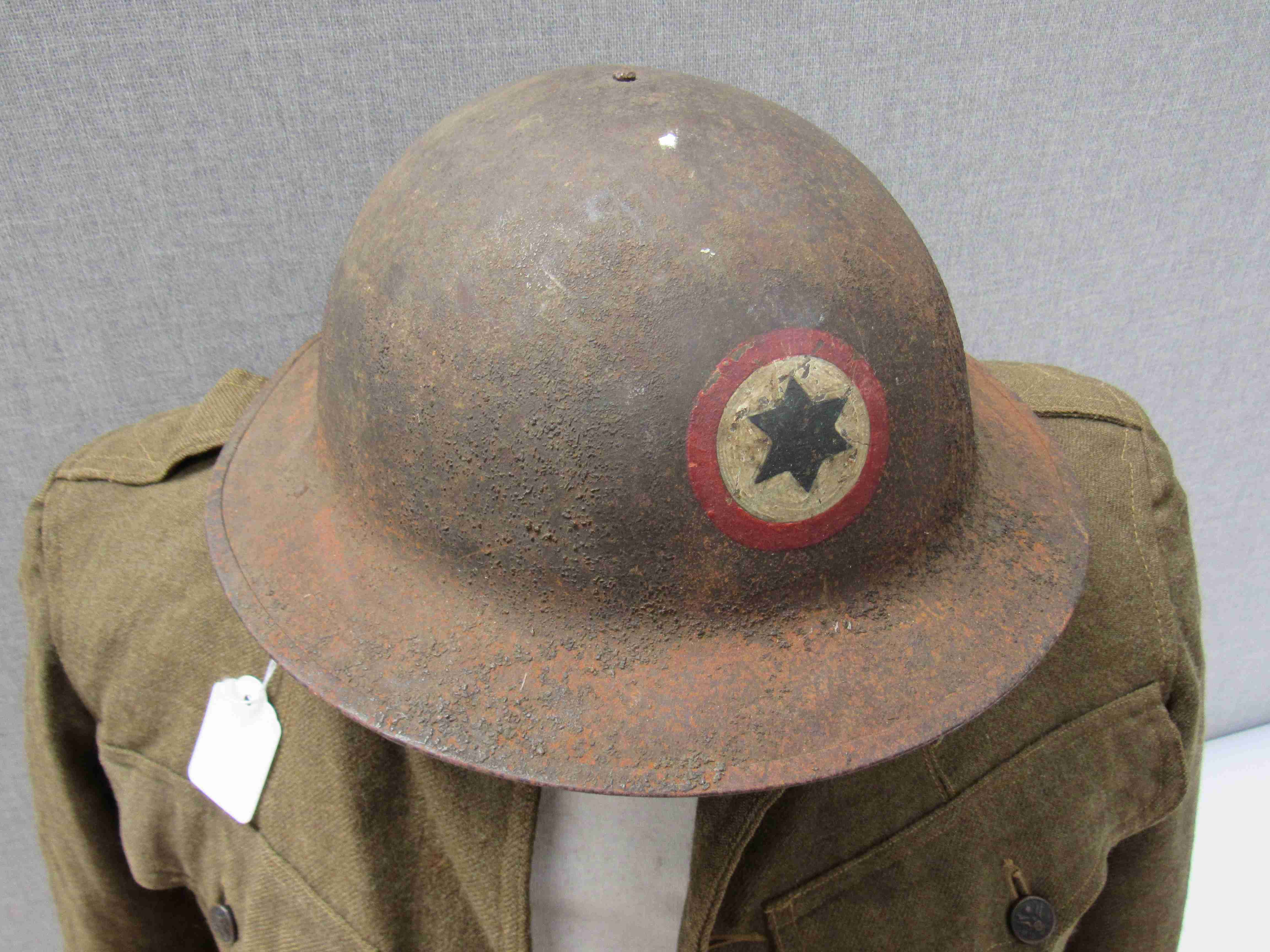 A WWI US soldier's service jacket with US Army insignia and US Army Brodie helmet with division - Image 7 of 8