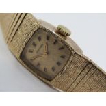 LONGINES: a lady's 9ct gold bracelet watch, circa 1970's, some stretch/wear to bracelet, 16mm case