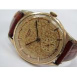 LONGINES: A gent's mid 20th Century gold plated and steel cased wristwatch, dial stained and case