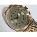 DRIVA: A gent's 18ct gold cased manual wind chronograph wristwatch, silvered Arabic dial signed ''