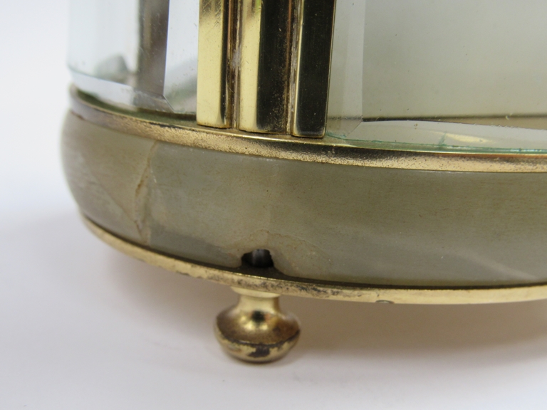 An early 20th Century brass and onyx cased French single train carriage timepiece of oval form. - Image 4 of 5