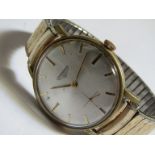 LONGINES: a gent's steel and gold plated cased wristwatch (case plating worn), silvered dial with