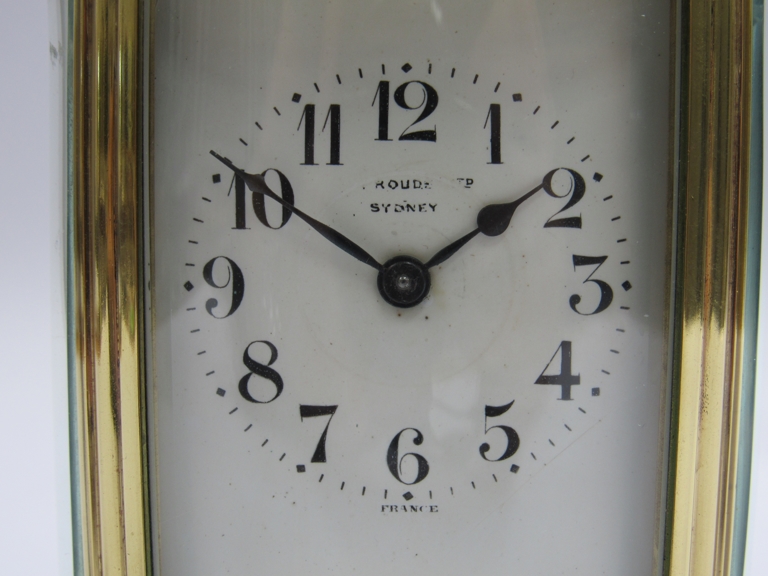 An early 20th Century brass and onyx cased French single train carriage timepiece of oval form. - Image 2 of 5