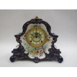 A late 19th Century ceramic mantel clock with Ansonia striking movement, Arabic enamelled dial a/