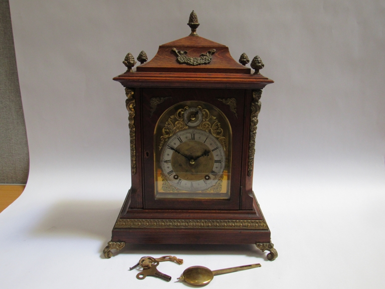 A late 19th Century Winterhalder & Hofmeier oak bracket clock with ormolu finials, mounts and