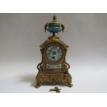 A mid to late 19th Century French ormolu timepiece with rococo motifs, hand painted and gilt