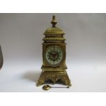 A 19th Century French brass cased decorative mantel timepiece with pendulum, enamelled Arabic