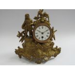 A 19th Century French gilt metal figural timepiece with key and pendulum depicting Napoleon