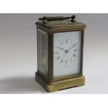A late 19th Century brass cased striking carriage clock, Roman enamelled dial signed Dent, 61
