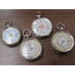 Four late 19th/early 20th Century silver fob watches with decorated dials, one keyless