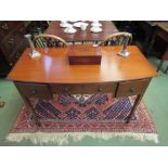 A Waring & Gillow mahogany side table, single drawer flanked by two drawers, tapering legs,