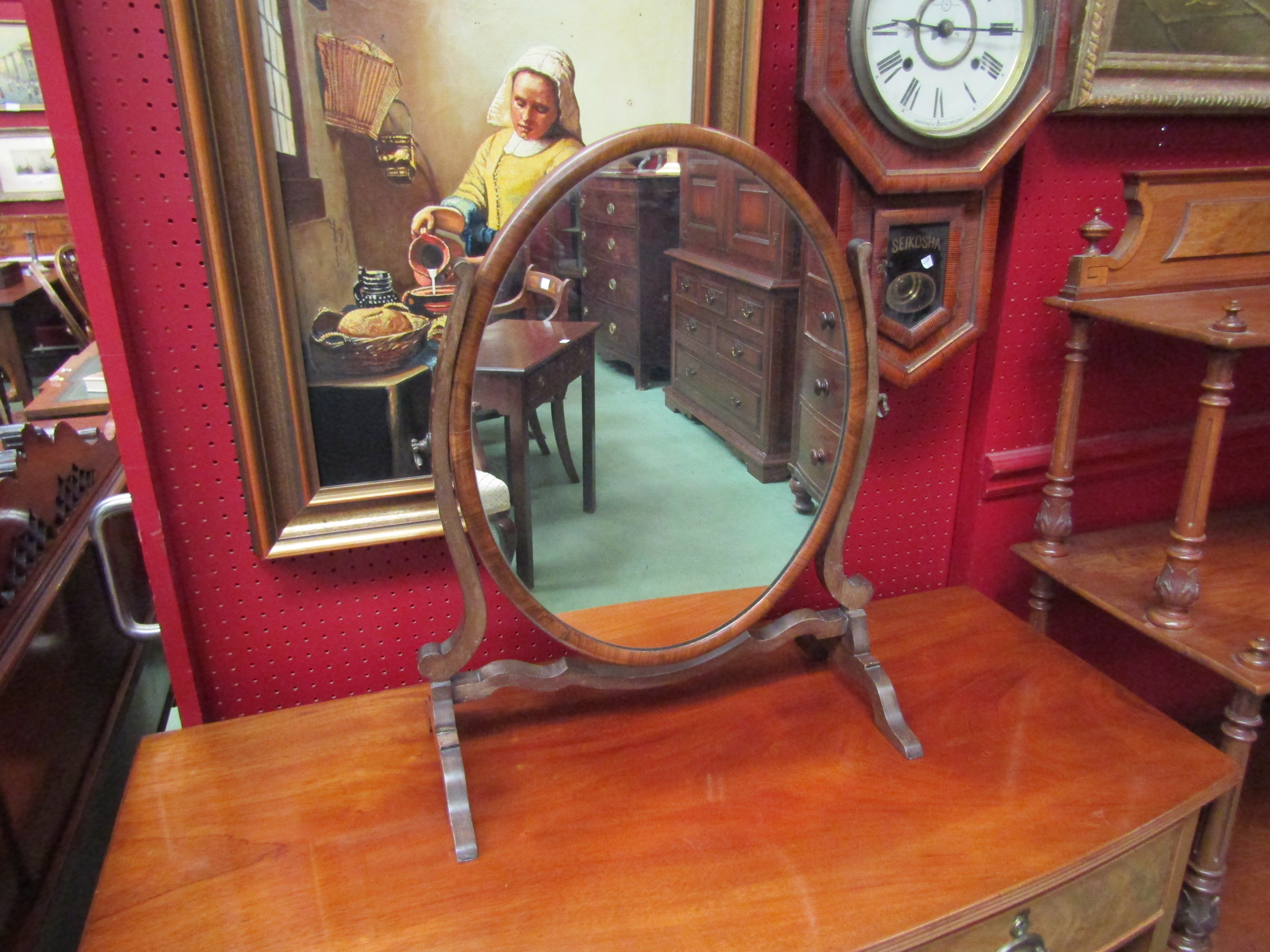 A Regency style mahogany swivel mirror