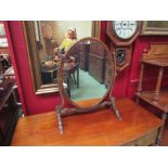 A Regency style mahogany swivel mirror