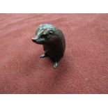 A limited edition bronze hedgehog, standing.