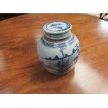 An 18th Century porcelain lidded vase in blue and white