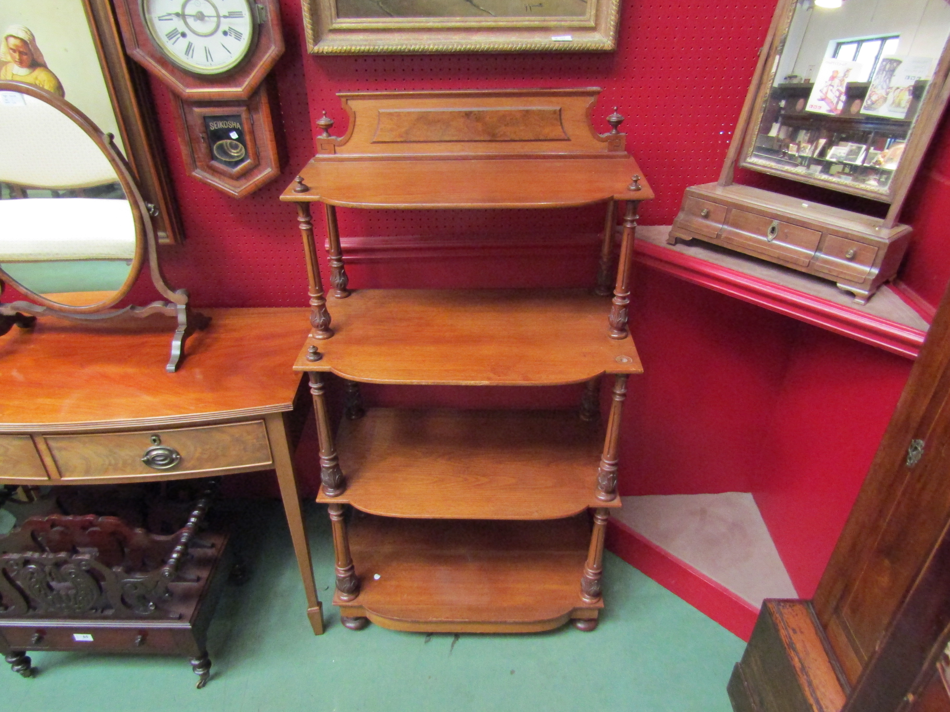 A late 19th Century four tier what-not with melon fluted supports,