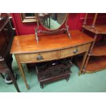 An Edwardian mahogany bow front two drawer side table