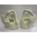 A pair of white swan porcelain jardinieres, reg.