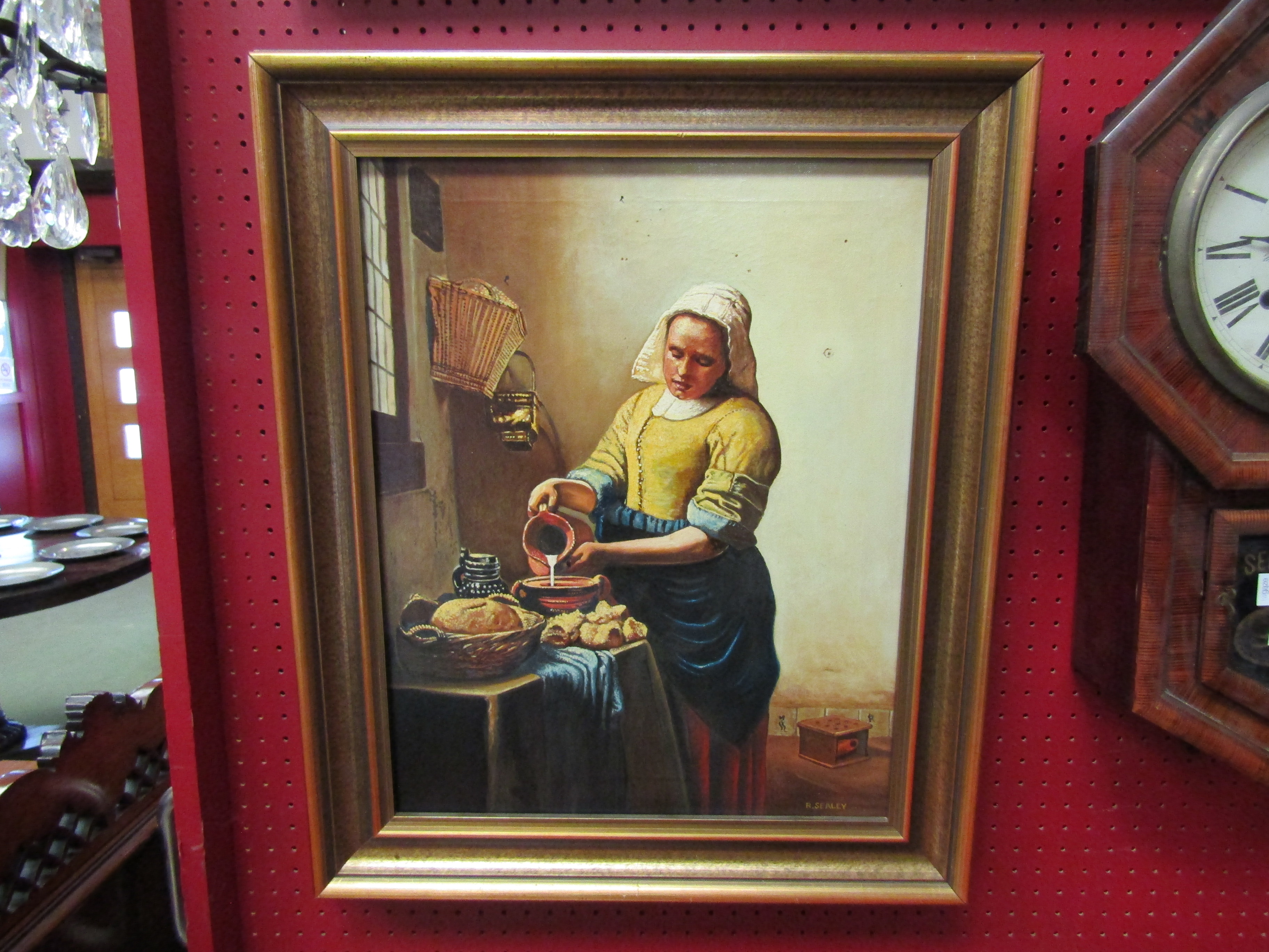 A 20th Century oil on canvas of maid in bakery, signed R.